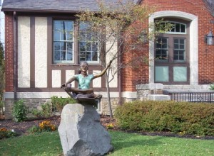 "girl reading" statue