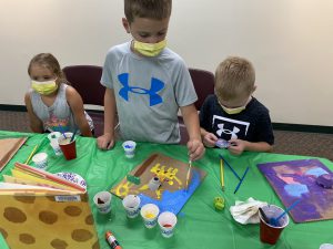 children work on their animal portraits