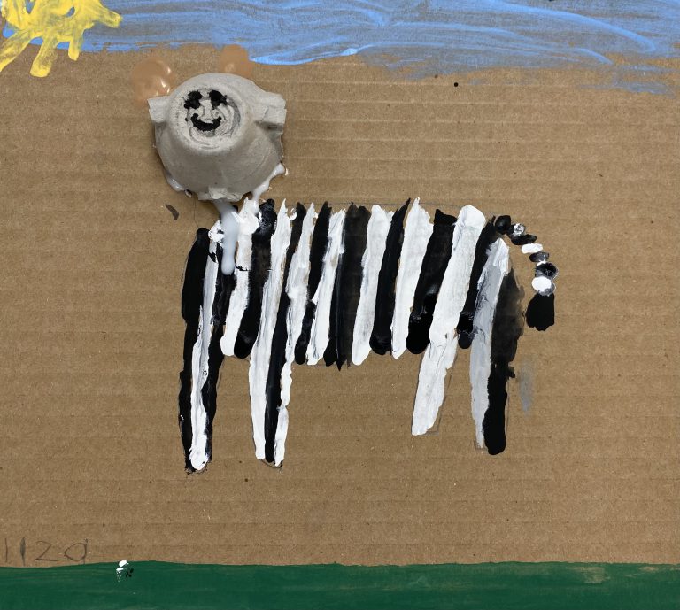black and white striped animal portrait with egg carton cup head