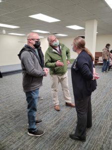 Children's coordinator Cherilyn Wise talks with patrons at the open house.