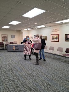 Director Tina Dalton talks with patrons at the open house