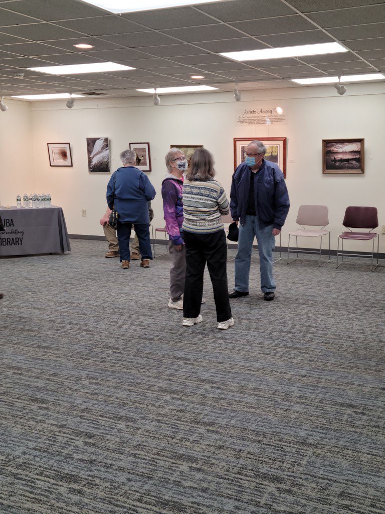 Patrons and members of the Friends talk during the open house.