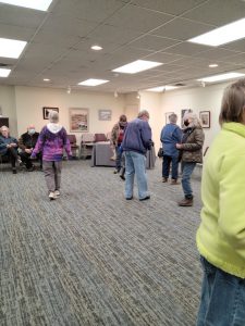 Patrons, board members, and members of the Friends talk during the open house.