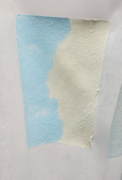 handmade paper that is half pale green and half light blue