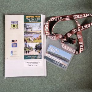 empire pass card with laminated pamphlet and brown lanyard with plastic card sleeve