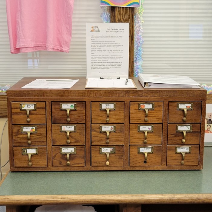 old style library card catalog with fruit and vegetable labels on the drawers