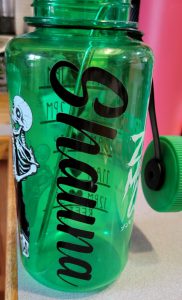 black vinyl name decal on green water bottle