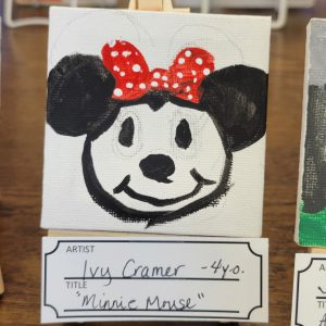 painting of Minnie Mouse with signature red bow with white polka dots on her head