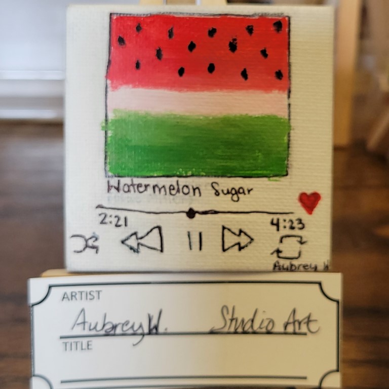 painting of a square with patterning like a watermelon (red, very pale pink, and green bands with black dots on the red) with Watermelon Sugar written underneath with a line, numbers representing song length, and music player symbols