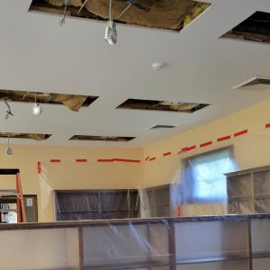 rectangular holes in ceiling with wiring hanging down