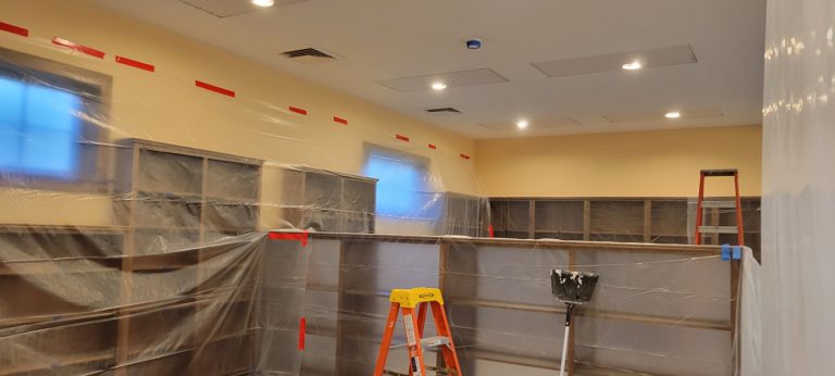 rectangular patches of drywall with circular LED lights