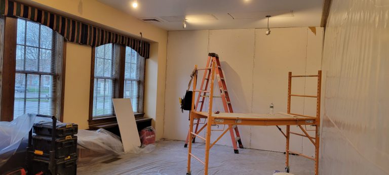 construction equipment with wall with drywall screwed in place