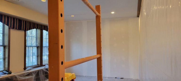 wall with more drywall compound over joints