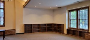 picture book corner area with bulletin board removed and wall painted white