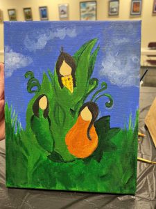 painting with blue sky with clouds and green grass with Native American "three sisters" plants of corn, squash, and green beans