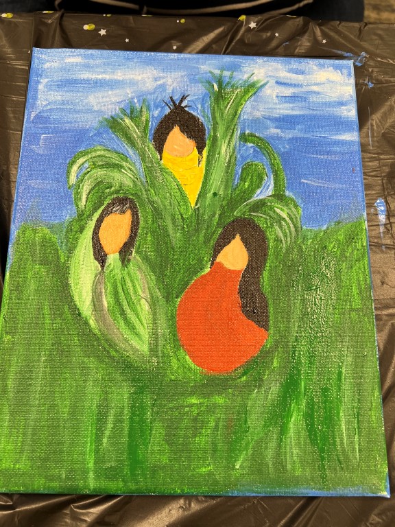 painting with blue sky and green grass with Native American "three sisters" plants of corn, squash, and green beans
