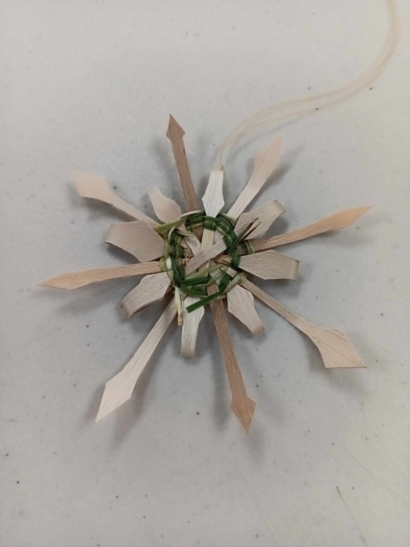 star or snowflake shaped ornament woven with sweetgrass and black ash splint