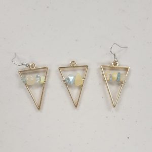 gold triangular bezels with pale blue and yellow crystal chips strung on wire across the center