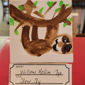 child's painting of tree branch with brown sloth hanging from it