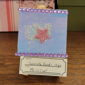 purple background with white iridescent glitter and pink glittery star with purple gem borders at top and bottom