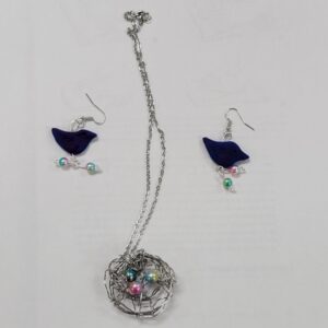 dark blue bird earrings and wire nest with rainbow beads