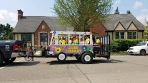 VW bus Parade float in front of library building