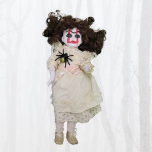 doll with ivory dress with spider crawling on it with Pennywise the clown makeup