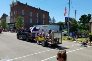 parade float being pulled down Main St in Cuba