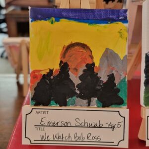 A vibrant landscape painting by a child depicting trees silhouetted against a colorful sky at sunset.