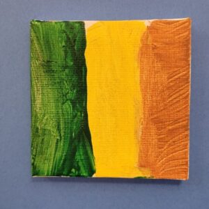 Small canvas with green, yellow, and brownish-orange vertical stripes on a blue background.