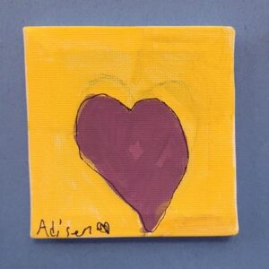 A small canvas with a yellow background and a dark pink heart in the center.