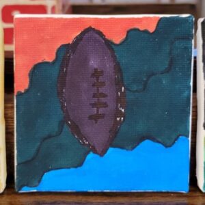 Abstract painting of a football with red, green, and blue background.