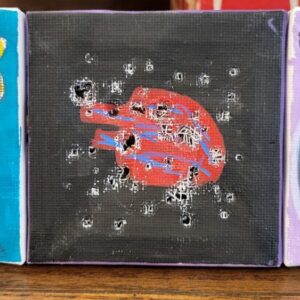 Abstract painting with red circular shape and white markings with holes on black background.