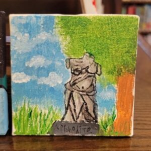 Small canvas painting of a statue with a blue sky and green foliage background.