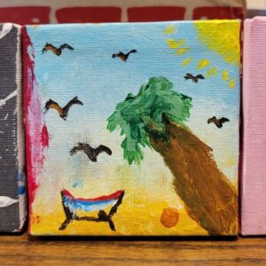A small painting of a palm tree under a blue sky with birds, and a red, white, and blue object near sandy ground.