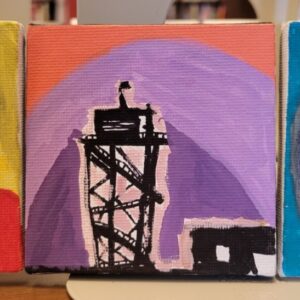 Silhouette of a tower against an orange and purple background.