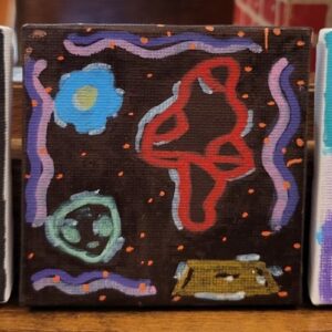 Abstract painting with vibrant shapes on a dark background.