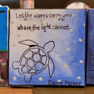 Small canvas with a sea turtle drawing and handwritten inspirational text "Let the waves carry you where the light cannot." on a light blue background with polka dots.