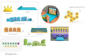 Collection of educational toys including coding tiles, game components, and magnetic tiles.