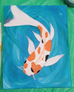 A painting of a koi fish with orange and black spots on a blue background.